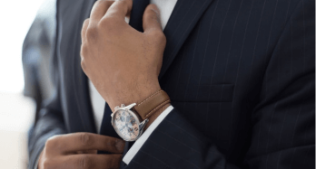 man in costume with watch 
